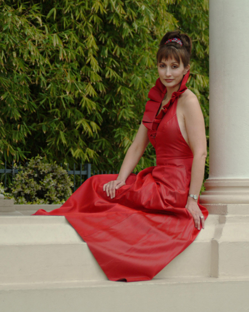 concert organist Carol Williams in a red gown