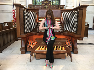 Carol Williams at a large organ console
